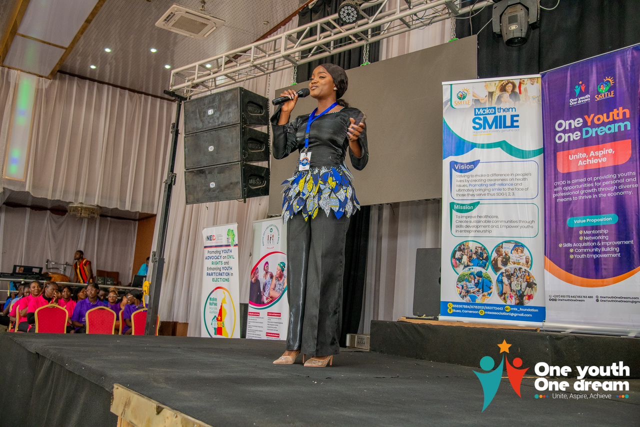 A speaker on stage at the One Youth One Dream conference